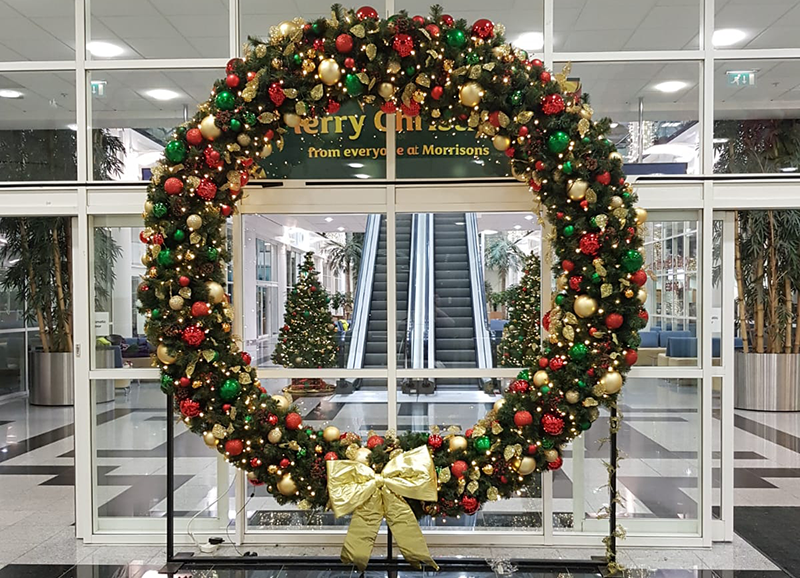 A giant Christmas Wreath in the entrance of the Office.